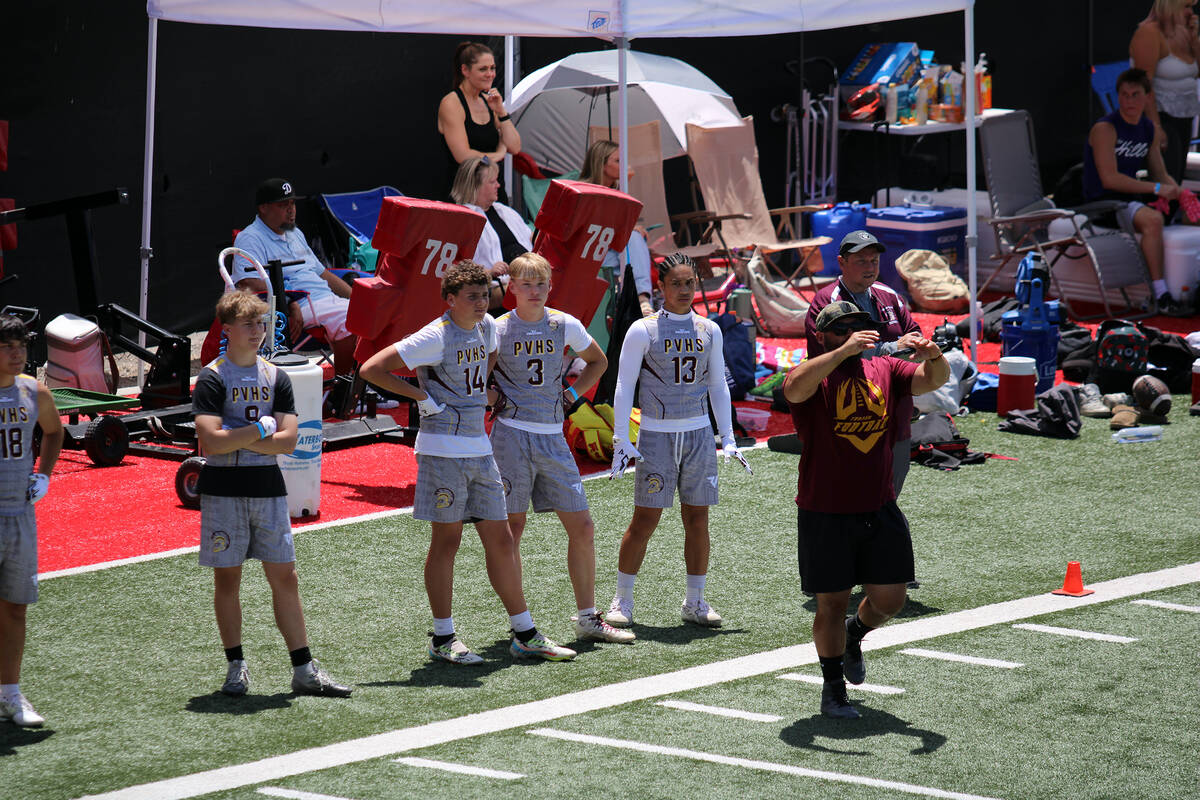 Pahrump Valley High School varsity football defensive coordinator Mike Colucci calls for an adj ...