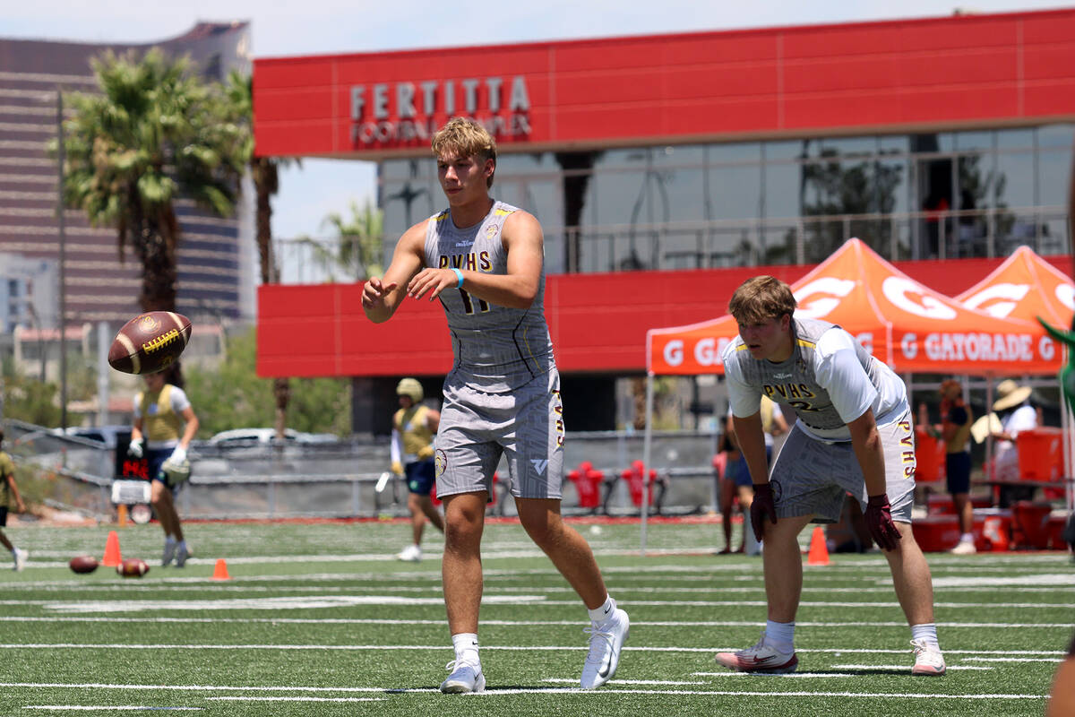 Pahrump Valley High School quarterback Hunter Wydick and running back Preston Dockter get set f ...