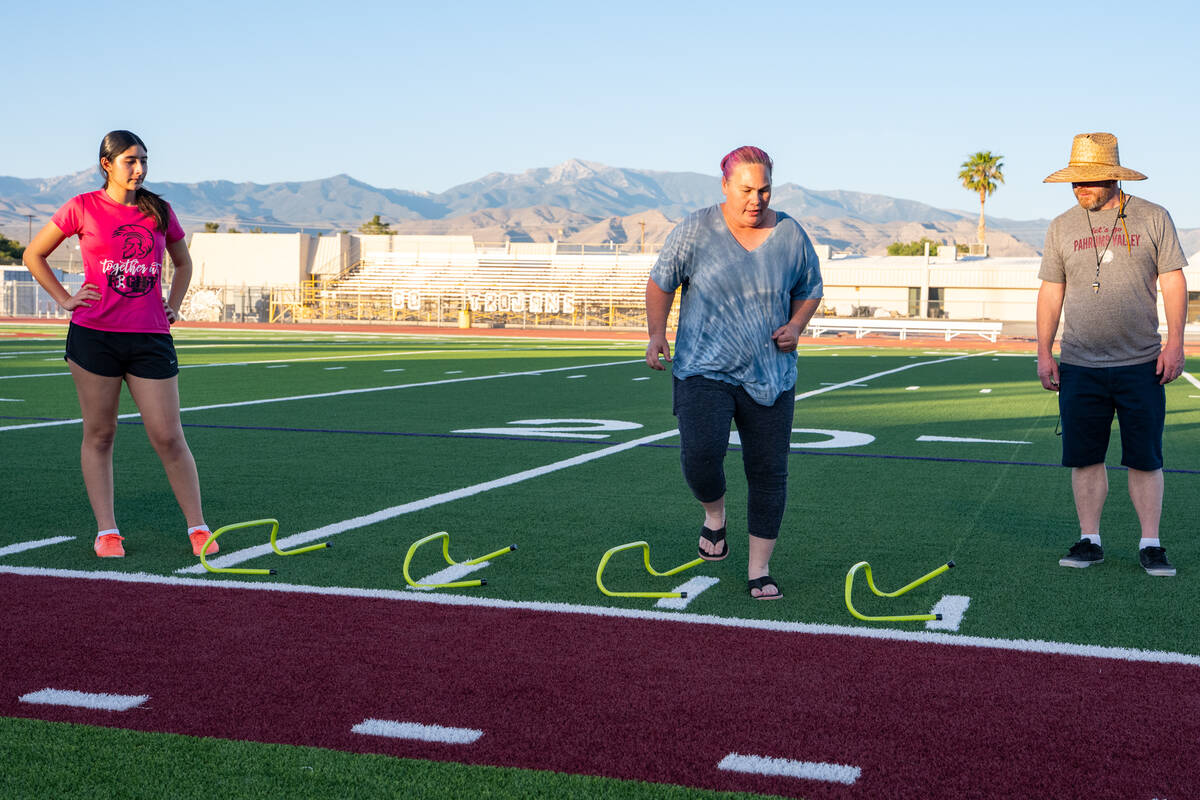 Pahrump Valley High School assistant head coach Jessica VanderWal runs through a drill during t ...