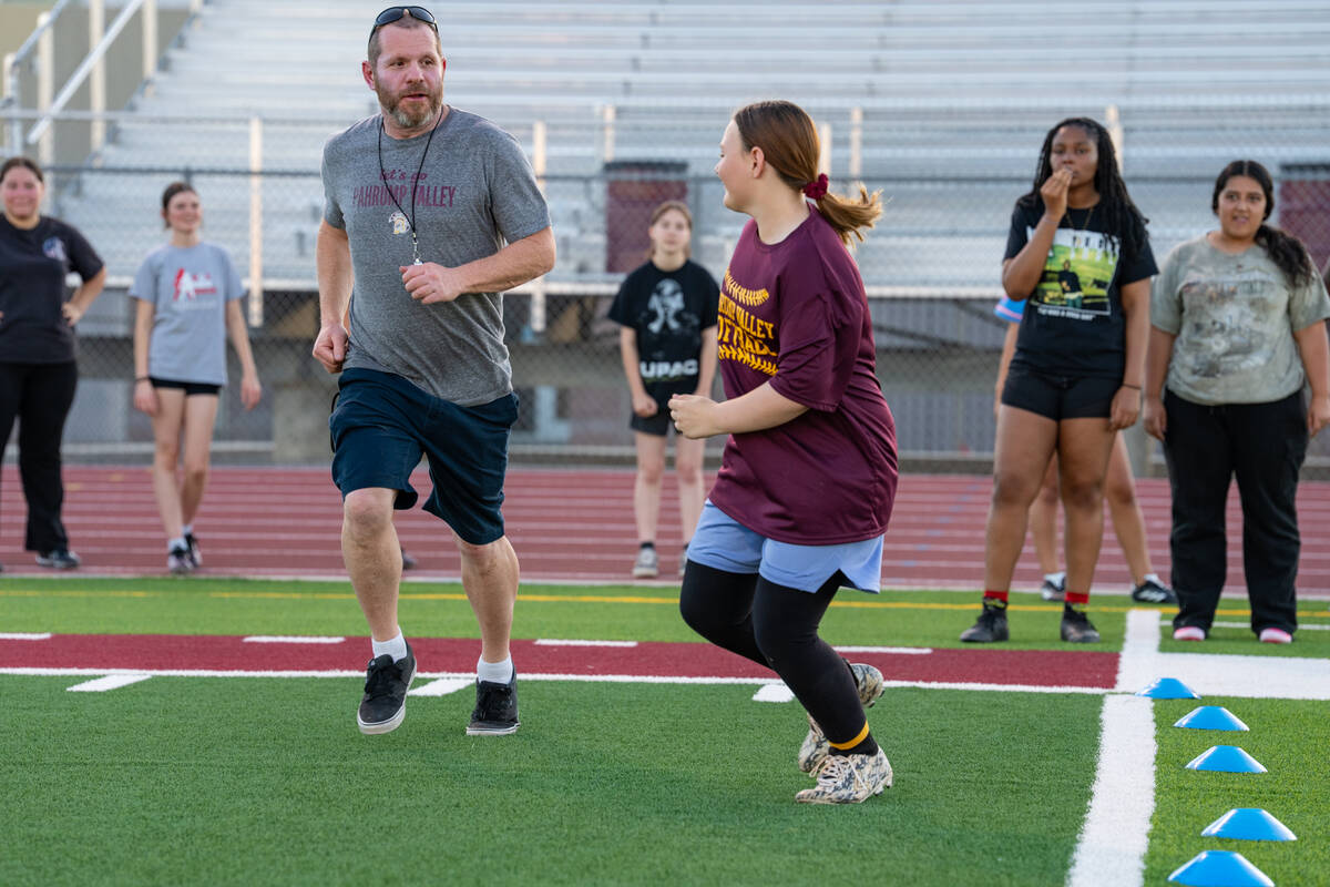 Pahrump Valley High School girls flag football head coach Jeff Corbett runs on the field during ...