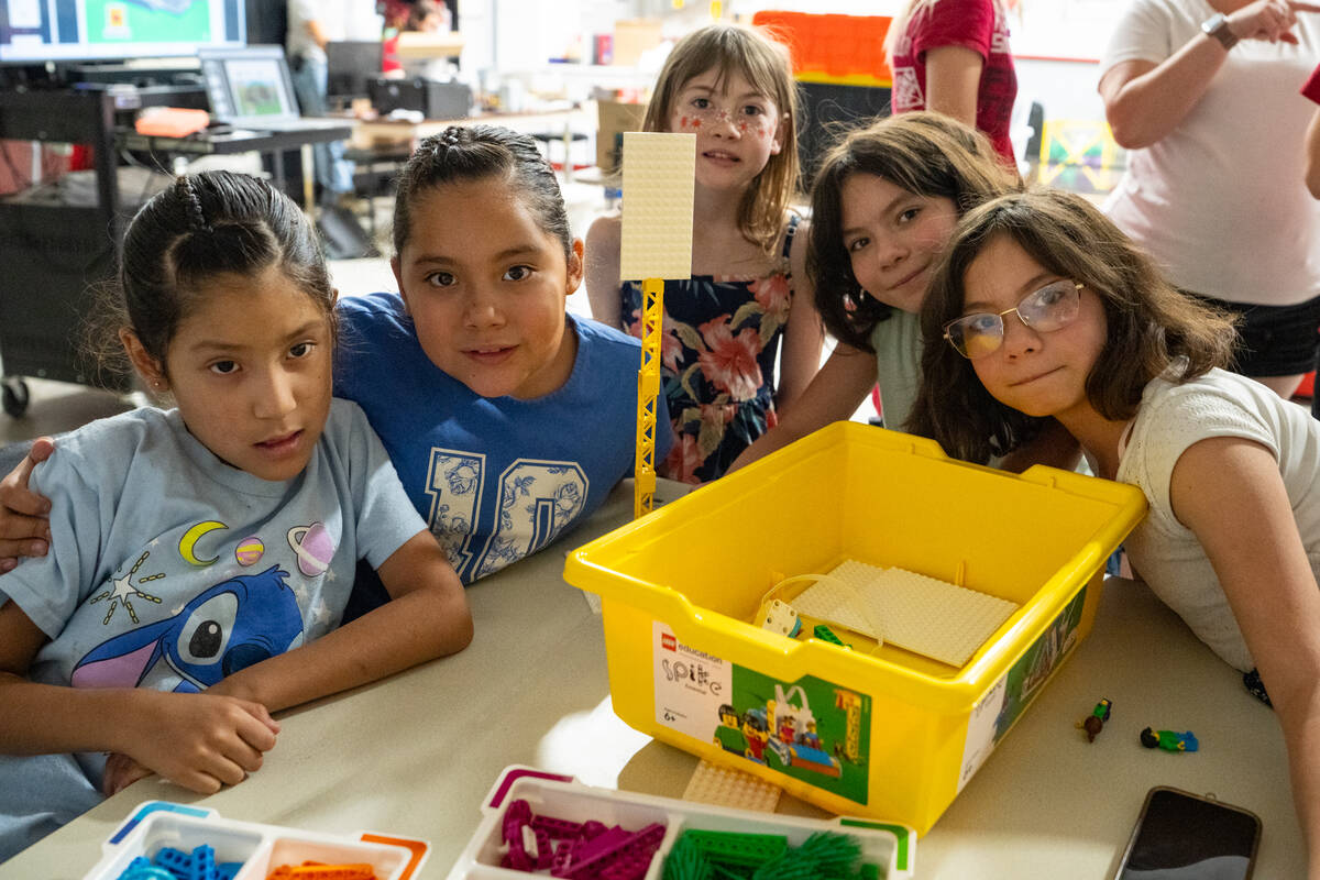 Youth campers participate in a Lego building project during the FIRST LEGO League summer roboti ...