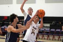 Pahrump Valley High School basketball player Kamden Moore attempts a jump shot against Lake Mea ...
