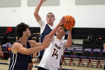 Pahrump Valley High School basketball player Kamden Moore attempts a jump shot against Lake Mea ...