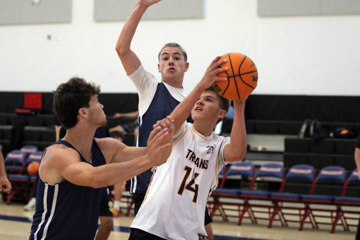 Pahrump Valley High School basketball player Kamden Moore attempts a jump shot against Lake Mea ...