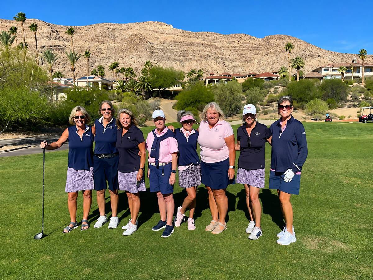 Members from the Mountain Falls Women’s Golf Association pose together following play of a to ...