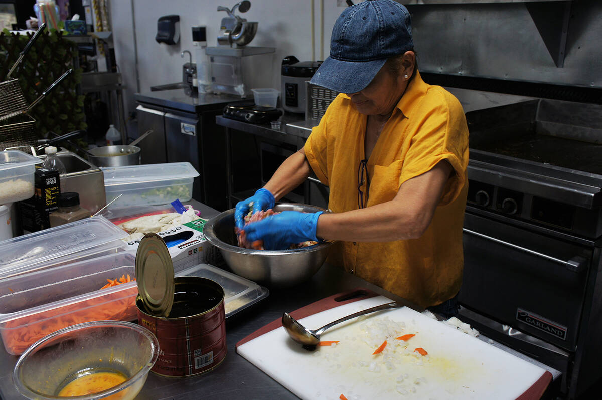 Oh My Lumpia! owner Lily Yates prepares freshly made lumpia at the new store located at 2301 Wi ...