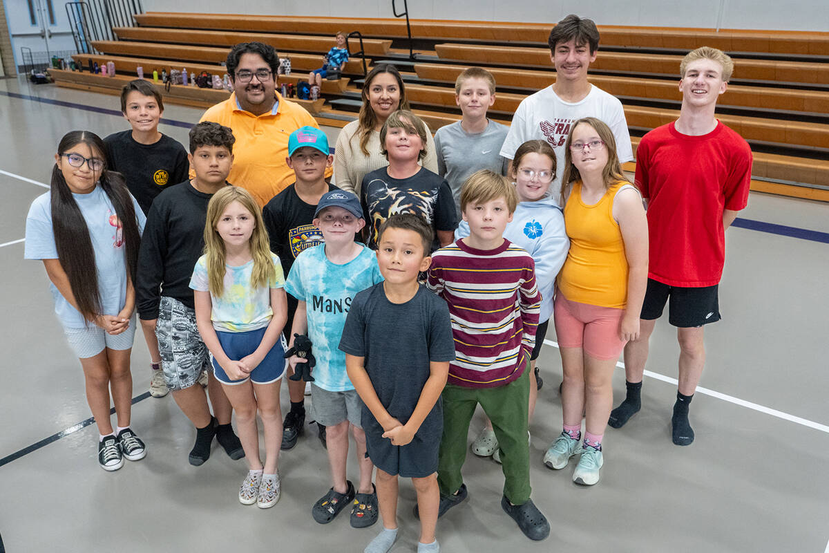 Pahrump Valley Youth Activities summer program participants take a break from their soccer game ...