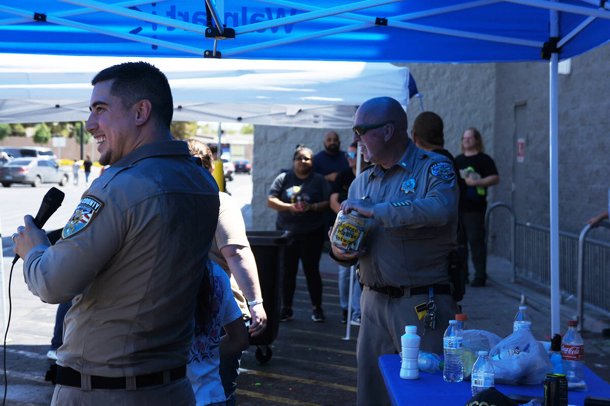 Throughout the event, sheriff’s office personnel invited people walking by to donate for a ch ...