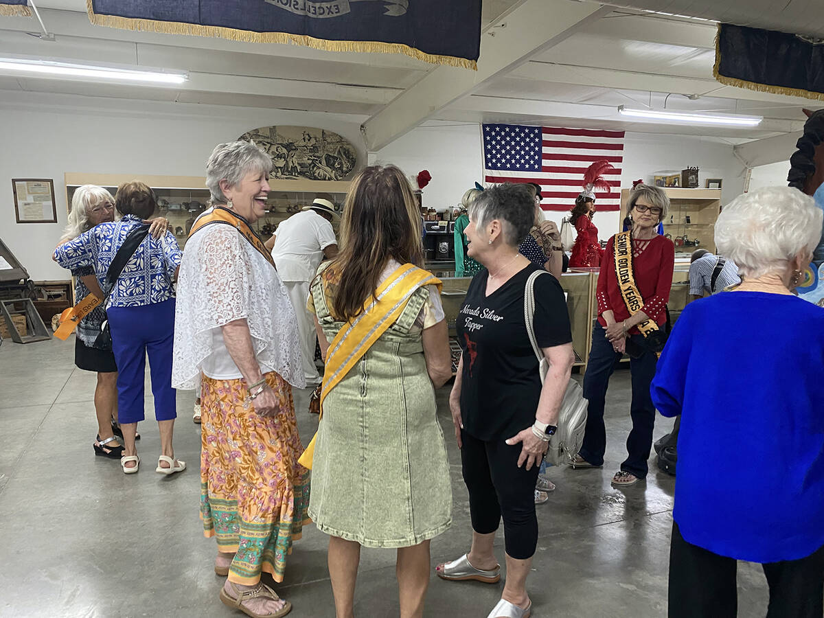Members of the Nevada Silver Tappers and Ms. Senior Golden Years, along with supporters, mingle ...