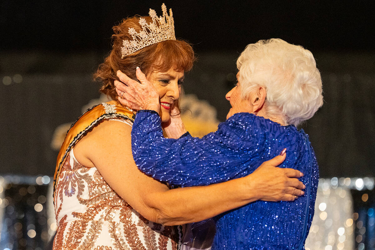 Ms. Senior Golden Years founder B.J. Hetrick-Irwin embraces newly crowned queen Gina Emond. (Jo ...