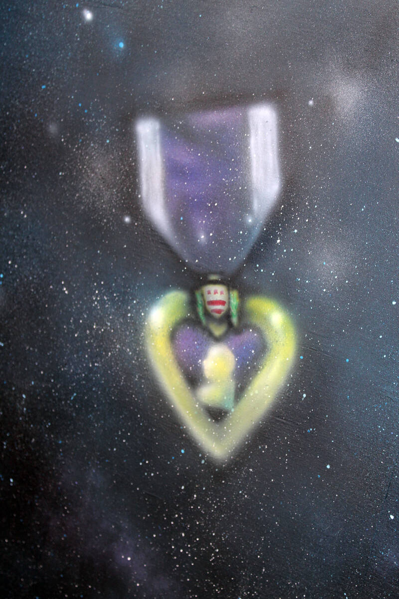 The Pahrump Tourism Info Center mural alludes to the town’s status as a Purple Heart entity. ...