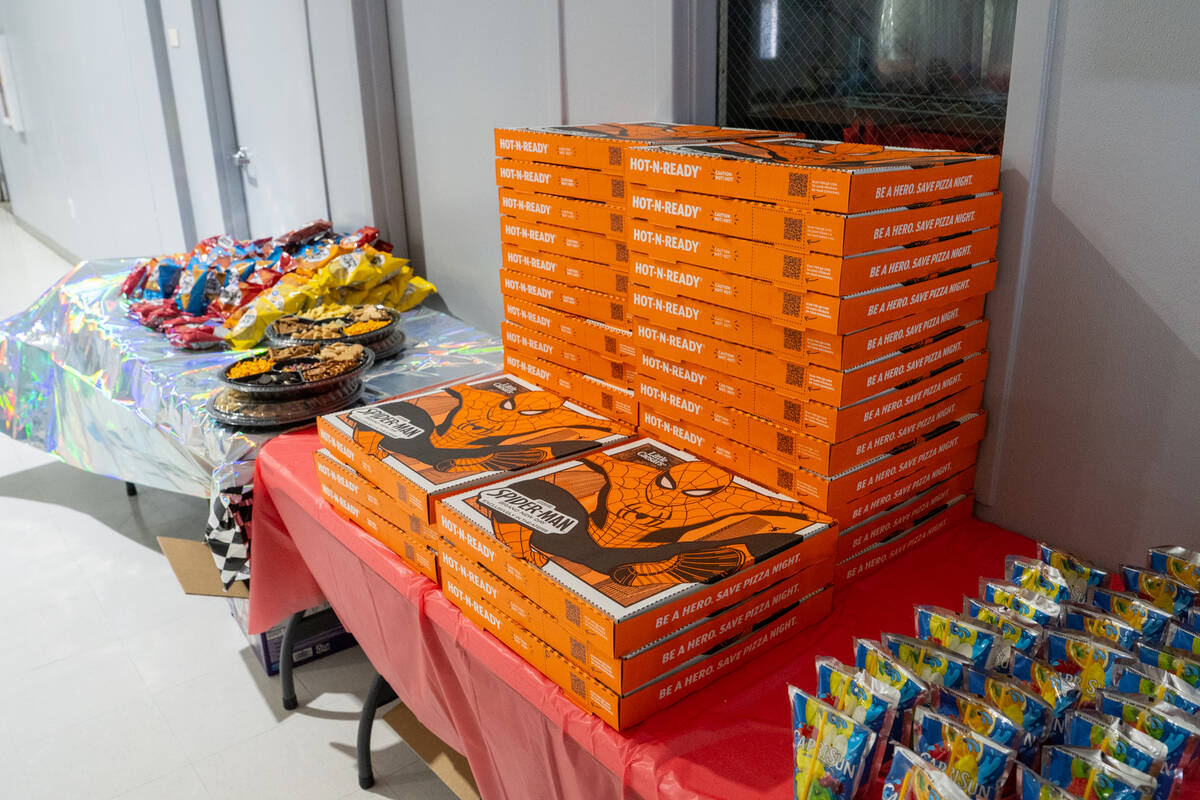 Free pizza, juice boxes and other goodies were provided to the kids and their parents. (John C ...