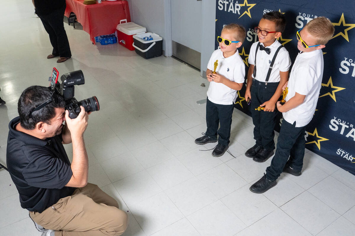 A professional photographer took pictures of youngsters with their free sunglasses, and “Osca ...