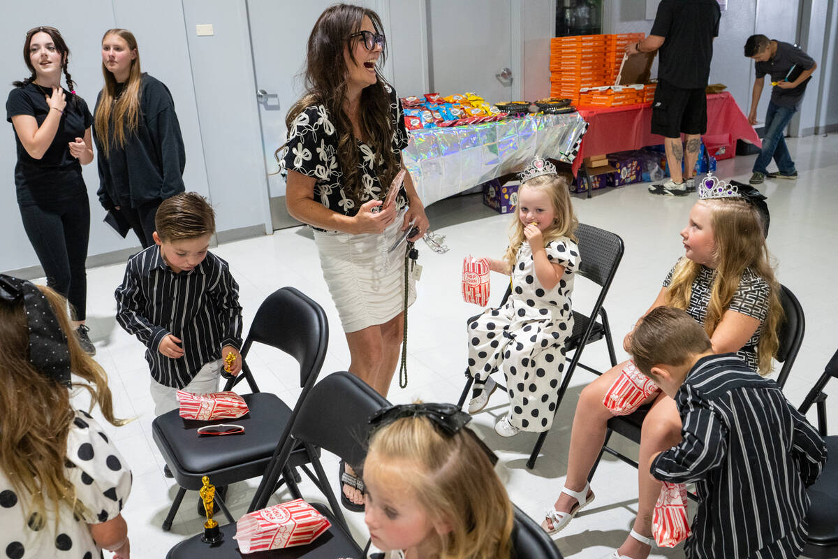 Jackie Lawson (c), sister of co-host Whitney McBride, attended the event with her children. “ ...