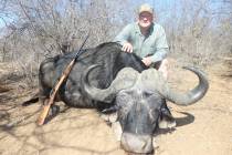 Wayne Bliss poses with his African Cape Buffalo, which is fearless and ferocious when cornered ...
