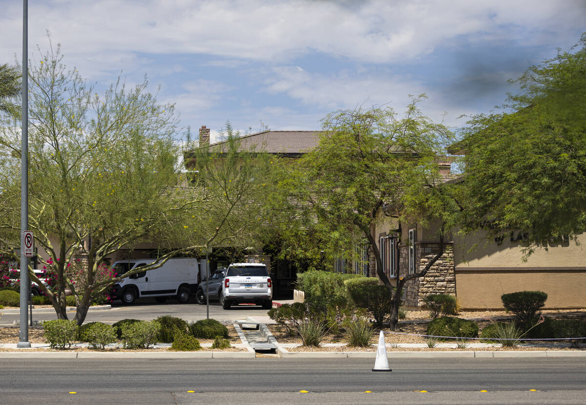 A Clark County Coroner vehicle is seen at Advanced Health Care of Las Vegas, where police were ...