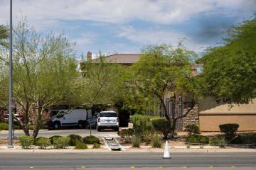 A Clark County Coroner vehicle is seen at Advanced Health Care of Las Vegas, where police were ...