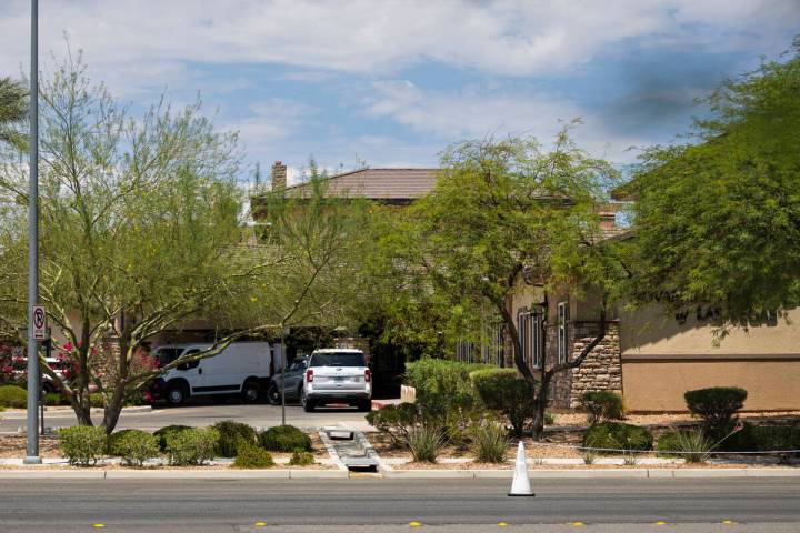 A Clark County Coroner vehicle is seen at Advanced Health Care of Las Vegas, where police were ...