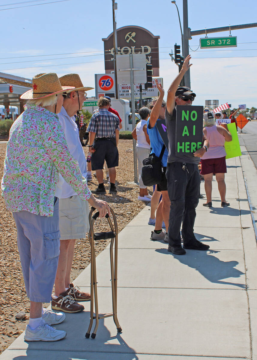 Bearing signs with statements such as "No data centers" and "No AI here", Pahrump residents gat ...