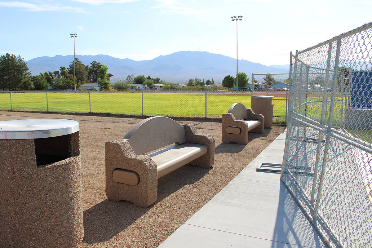 Two new benches and a trash receptacle have been added to the front of the Simkins Park Splash ...