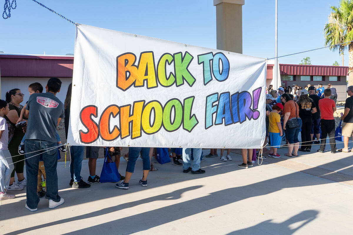 Long lines of families ready for free backpacks and school supplies were found during the event ...