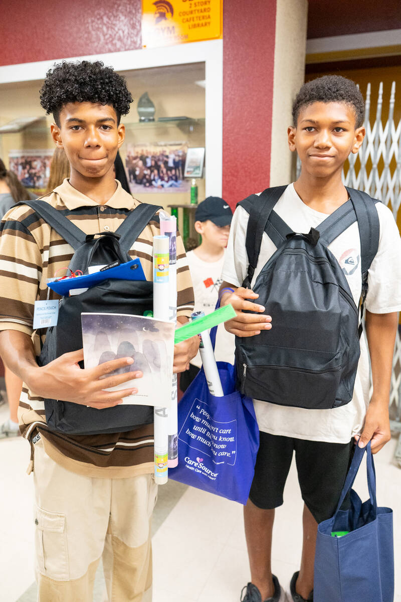 These Back to School Fair attendees had their hands full of free goodies collected from the eve ...