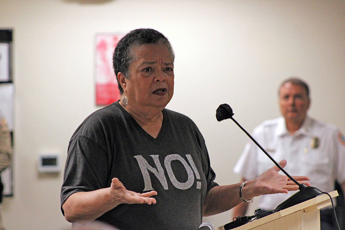 Area resident Jean Alexander Booth was among the more 75 people who took to the microphone to v ...