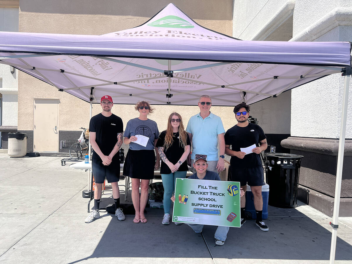 A large canopy was set up outside of Albertson's to shield volunteers from the intense sun as t ...