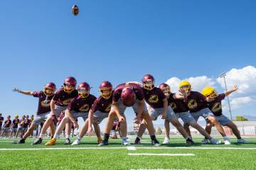 The Trojans' field-goal unit works through a kicking drill during football practice, Aug. 5. (J ...