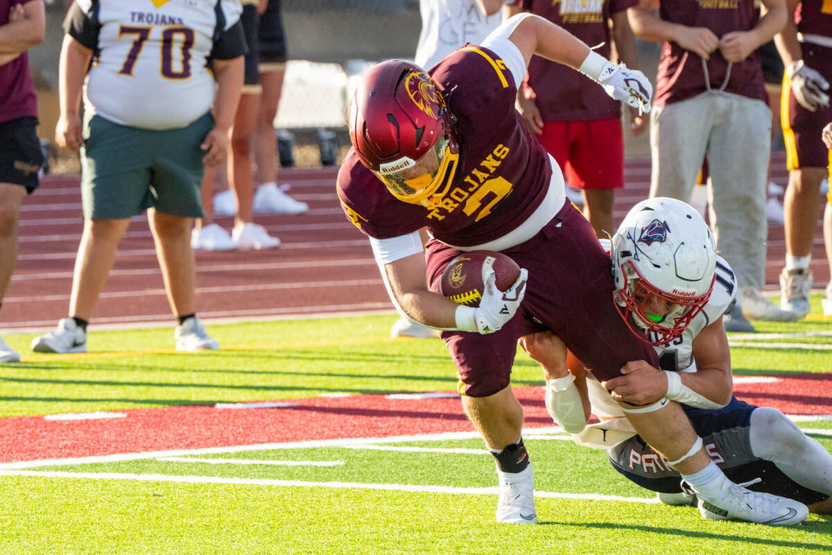 Preston Dockter fights through a Providence Hall tackle during Pahrump Valley’s 29-6 season-o ...