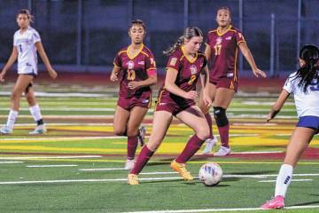 Pahrump Valley’s Sydney Crotty works through The Meadows defense during a home league match l ...