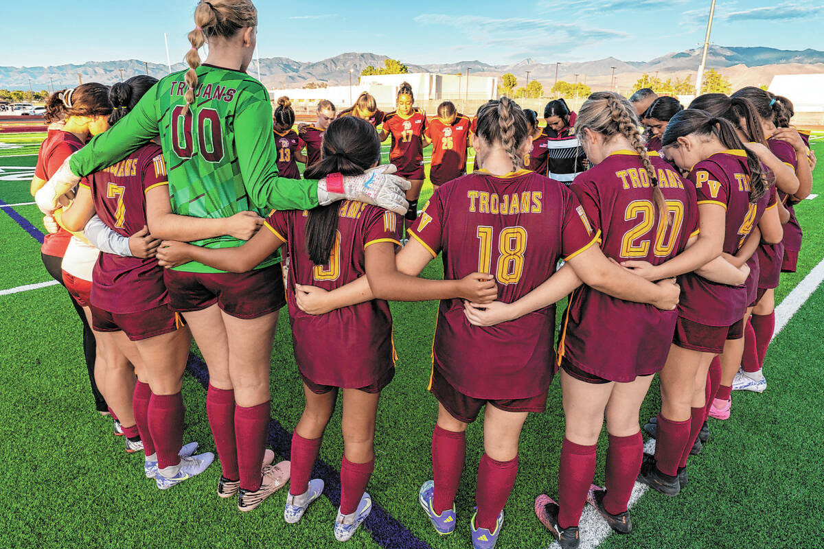 Members of the Pahrump Valley girls soccer team gather before a home league match against The M ...