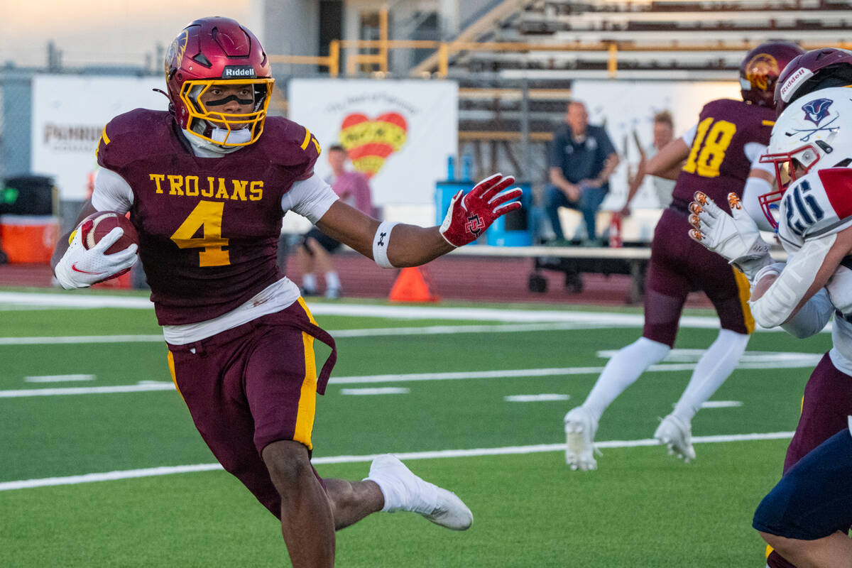 Pahrump Valley’s Iyan Bosket carries the ball against Providence Hall during the Trojans’ 2 ...