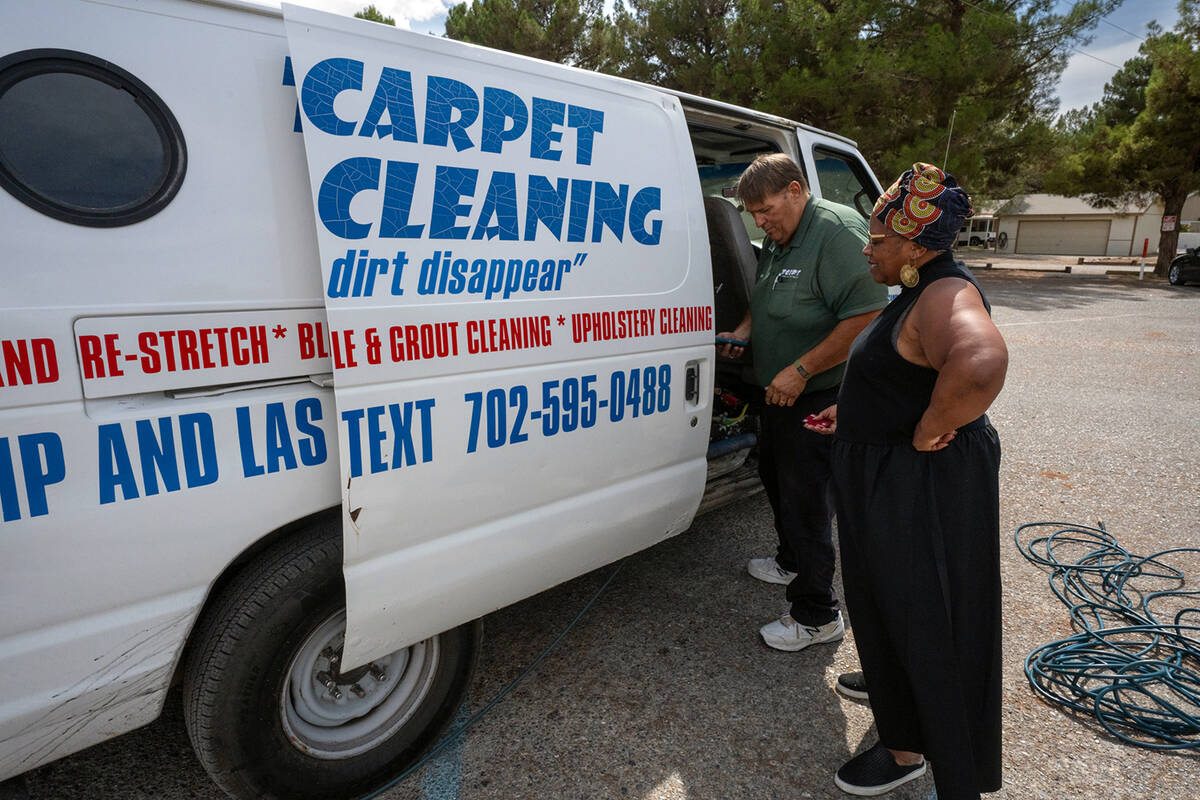 MLK Scholarship Foundation President Saundra Fisher greets Todd Cottino of Todd's Carpet and Ti ...