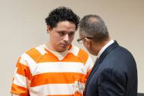 Anthony Aguilar (left) speaks with his attorney Christopher R. Oram (right) in Pahrump Nevada's ...