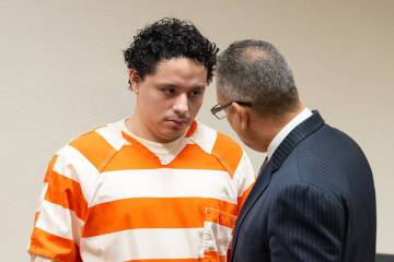 Anthony Aguilar (left) speaks with his attorney Christopher R. Oram (right) in Pahrump Nevada's ...