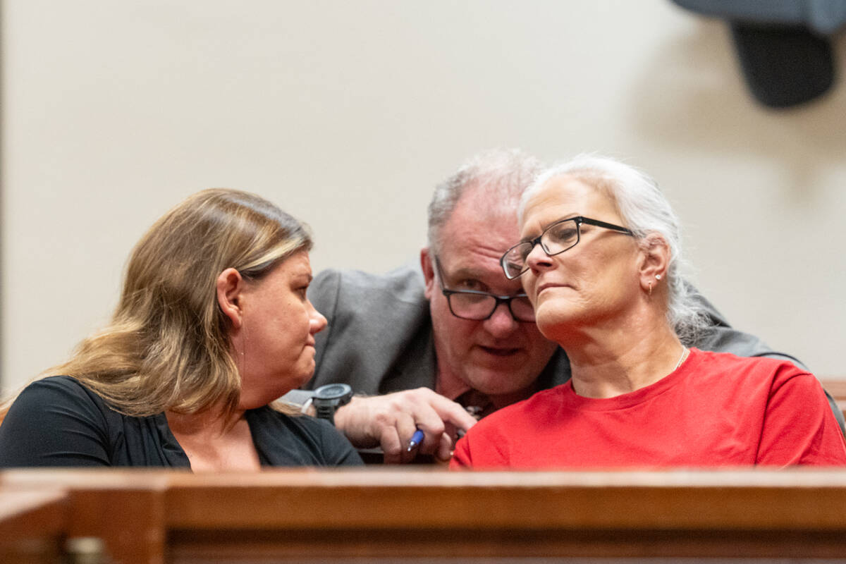 Senior Deputy District Attorney Keith Brower (center) confers with Joey Perry's mother, Mari Au ...