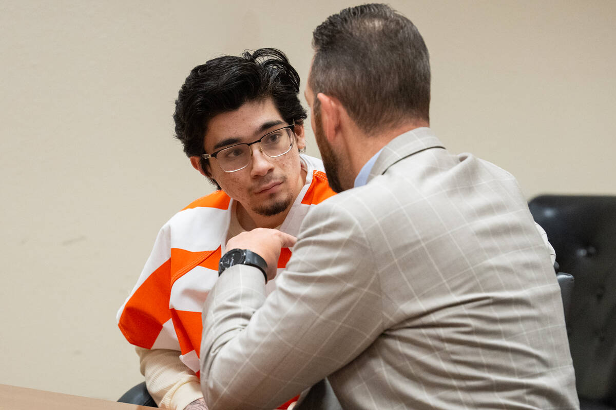 Carlos Blakely (left) talks with his attorney Michael A. Troiano (right) in Pahrump Nevada's Fi ...