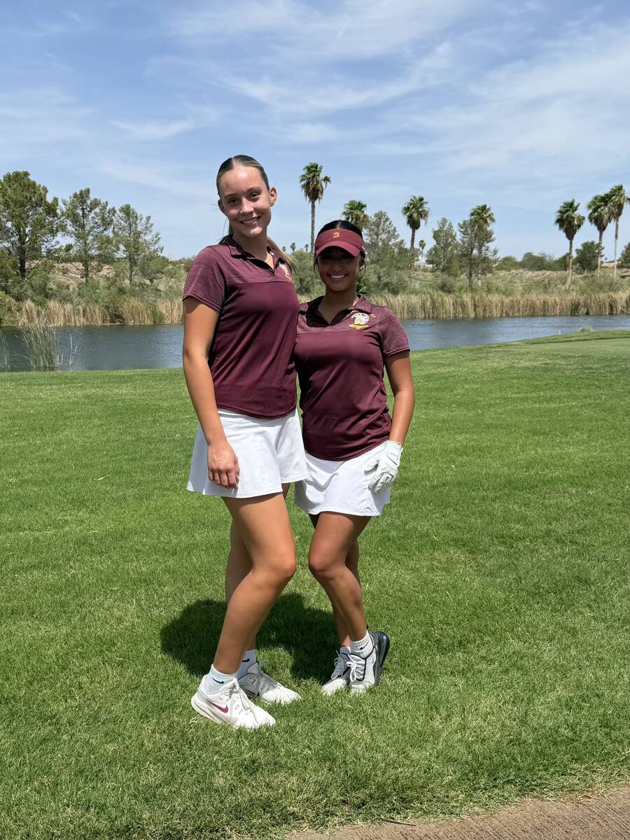 Pahrump Valley golfers Raegan Saldana, left, and Natalie Soto represented the Trojans during th ...