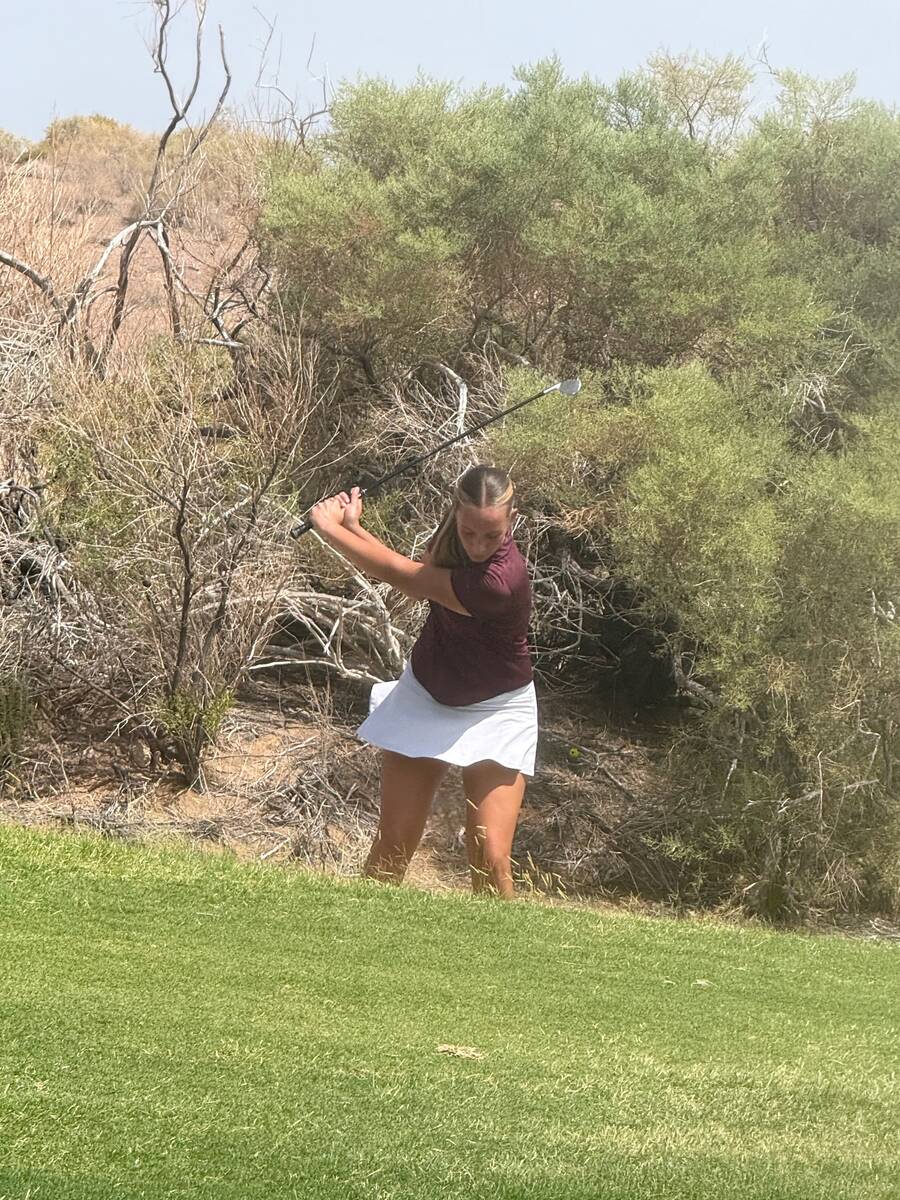 Pahrump Valley sophomore Raegan Saldana hits from the rough during the season-opening Class 3A ...