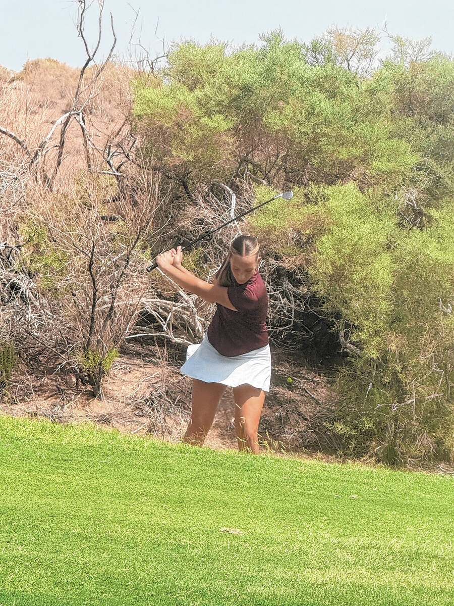 Pahrump Valley sophomore Raegan Saldana hits from the rough during the season-opening Class 3A ...