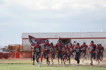 Duffy Otteson/Special to the Times-Bonanza Tonopah High School players take the field before Fr ...