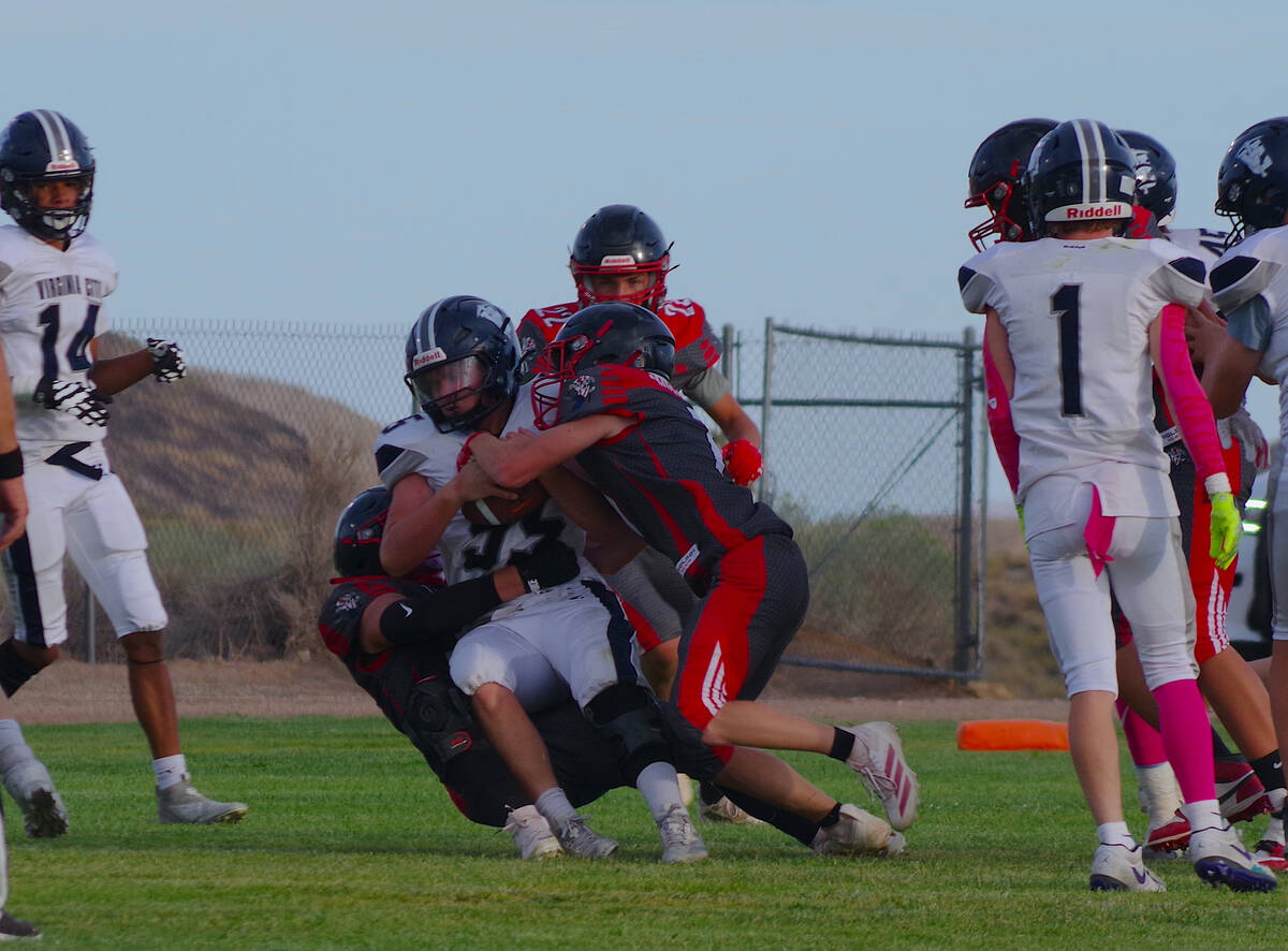 Marcus Prazniak/Special to the Times-Bonanza Tonopah defenders bring down a Virginia City ball ...