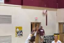 Pahrump Valley’s Alyvia Morin (2) plays the ball as teammate Evalenne Armendariz (16) moves i ...