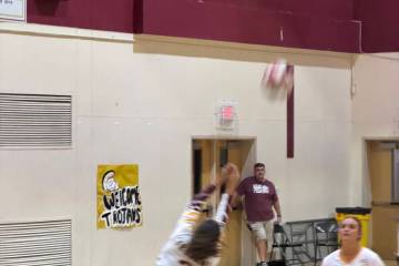 Pahrump Valley’s Alyvia Morin (2) plays the ball as teammate Evalenne Armendariz (16) moves i ...