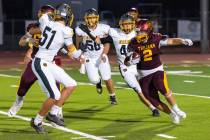 Pahrump Valley senior running back Preston Dockter carries the ball through the Galena defense ...