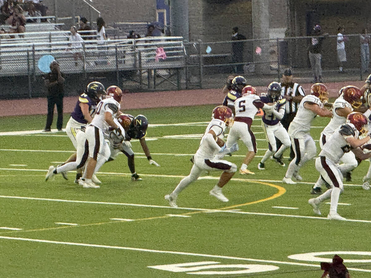 Pahrump Valley’s John Wydick (11) advances the ball through traffic during Friday’s game ag ...