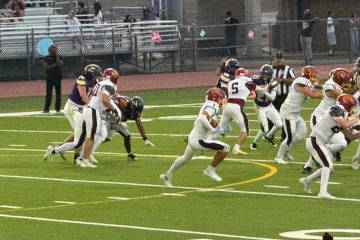 Pahrump Valley’s John Wydick (11) advances the ball through traffic during Friday’s game ag ...