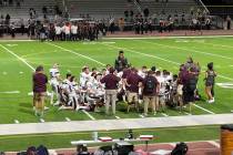 Pahrump Valley players gather around their coaches following a 56-8 victory over Chaparral on F ...