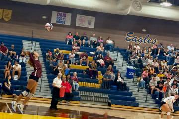 Pahrump Valley senior Riley Saldana sends a serve toward Boulder City during the Trojans’ str ...
